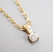 A modern 9ct gold and diamond set pendant, on a 9ct gold chain, chain, 38cm, gross weight 2.2