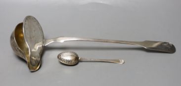 A 19th century continental white metal serving ladle, 36cm and a late Victorian silver tea