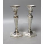 A pair of sterling hexagonal candlesticks, maker L.H?, 17.5cm, gross 561 grams.