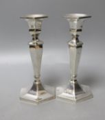 A pair of sterling hexagonal candlesticks, maker L.H?, 17.5cm, gross 561 grams.