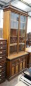 A late Victorian Aesthetic movement oak and pollard oak bookcase, width 114cm depth 50cm height