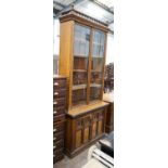 A late Victorian Aesthetic movement oak and pollard oak bookcase, width 114cm depth 50cm height