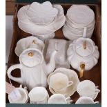 A Shelley white glazed part tea service, dainty shape, some gilt rims and handles