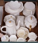 A Shelley white glazed part tea service, dainty shape, some gilt rims and handles