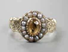 An early 19th century engraved yellow metal, citrine and seed pearl set oval cluster ring, size R,