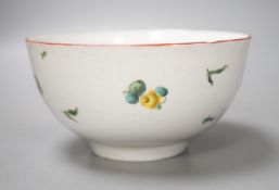 A Bristol porcelain bowl painted with a spray of flowers and scattered sprigs, crossed swords dot