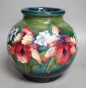 A Moorcroft green glaze 'spring flowers' squat vase,21 cms high.