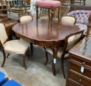 A 19th century French mahogany extending dining table on cabriole legs, width 134cm extended, one