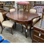 A 19th century French mahogany extending dining table on cabriole legs, width 134cm extended, one