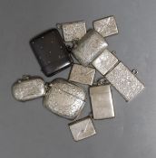 A small collection of assorted mainly early 20th century silver or metal vesta cases and silver