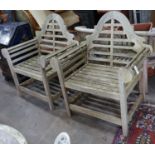 A pair of Lutyens style weathered teak garden armchairs, width 90cm depth 54cm height 105cm