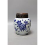 A 19th century Chinese blue and white jar with wood cover - 17cm high