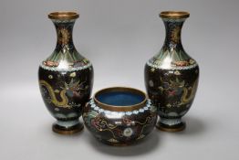 A pair of early 20th century Chinese cloisonne enamel 'dragon' vases and a matching bowl