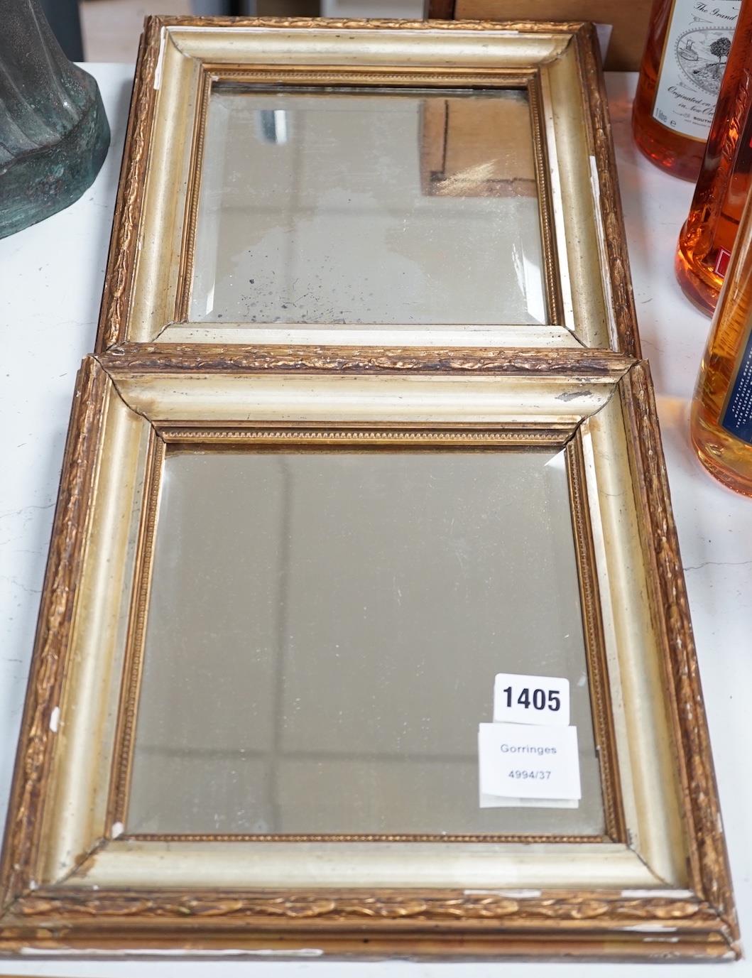 A pair of squared bevelled wall mirrors (2) 29cm sq including frames