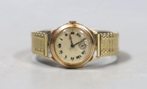 A gentleman's mid 20th century 9ct gold manual wind wrist watch, with Roman dial and subsidiary