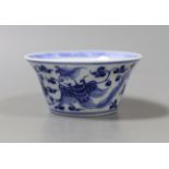 A Chinese blue and white bowl with floral motif, inscription to base - 4cm tall