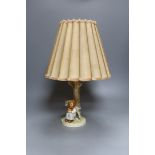 A Hummel figural table lamp,43 cms high including shade.