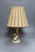 A Hummel figural table lamp,43 cms high including shade.