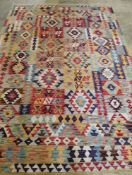 An Anatolian style polychrome Kilim carpet, 295 x 200cm