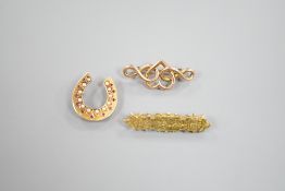 A late Victorian 15ct gold, seed pearl and gem set horseshoe brooch(a.f.), 24mm, 3.6 grams and tow
