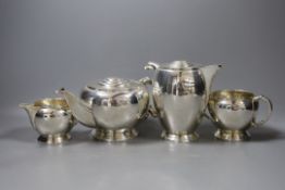A George VI silver four piece ovoid tea set, by Frank Cobb Ltd, Sheffield, 1945, gross weight