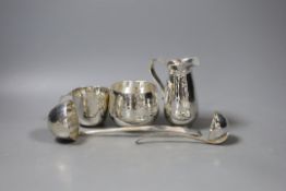 Five modern planished silver items by Pruden & Smith, including two bowls, a jug and two ladles, jug