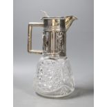 A late 19th/early 20th century German 800 standard white metal mounted cult glass claret jug,