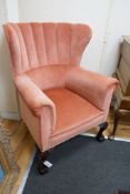 A George III style upholstered tub frame wing armchair, width 77cm depth 75cm height 100cm