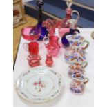 An assortment of cranberry glassware, graduated Masons Ironstone jugs, Chinese export plates etc.