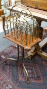 An Edwardian brass and mahogany Canterbury/magazine rack, width 42cm depth 27cm height 88cm