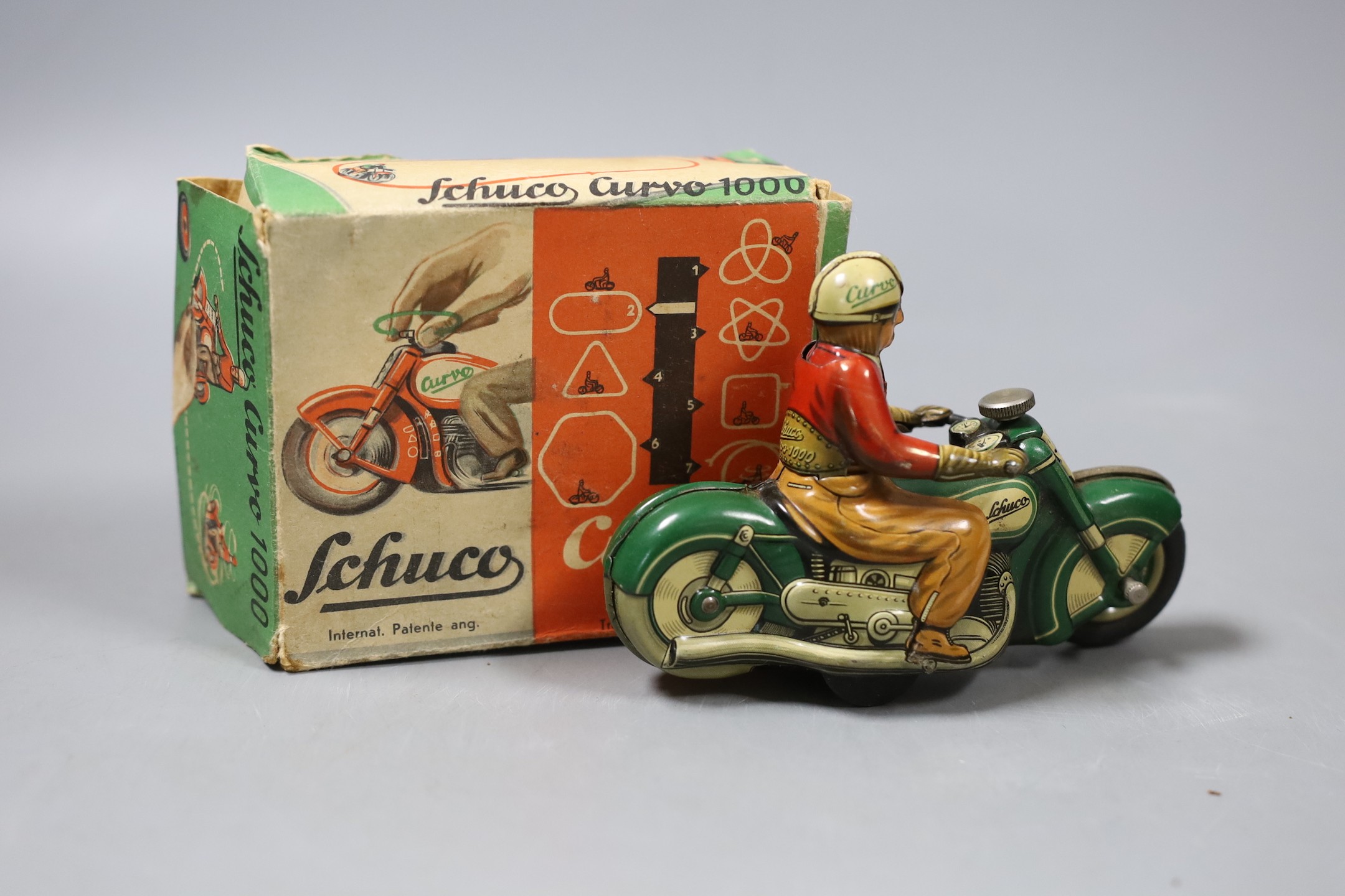 A Schuco Curvo 1000 model bike with original box and winding key