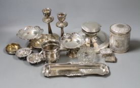 Assorted silver including a capstan inkwell, pair of dwarf candlesticks, pair of pedestal nut