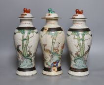 Three Chinese crackleware jars and covers, 26cm