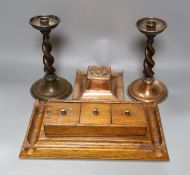 A copper Arts & Crafts inkwell, a pair of A Jones turned candlesticks and an early 20th century