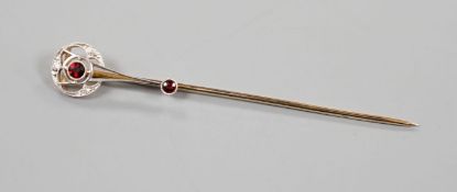 A cased American 14k, garnet and diamond chip set stick pin, by Shreeve & Company, 67mm, gross