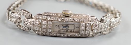 A lady's white metal and diamond set rectangular dial manual wind cocktail watch, with diamond set
