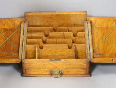 A late Victorian oak stationary box,30 cms high.