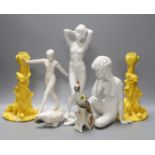 Two Kaiser porcelain figures, a Goebel figure, a pair of yellow glazed candlesticks with frogs and