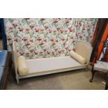 A Louis XVI style yellow painted upholstered French daybed, width 198cm, depth 69cm, height 88cm
