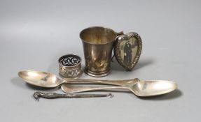 Two 18th century silver spoons, a later silver christening mug, small silver mounted heart shaped