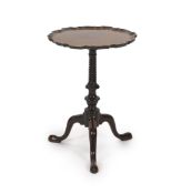 A George III and later mahogany tripod wine table, with circular piecrust top and spiral fluted stem
