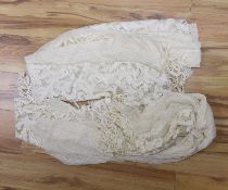 A pair of Edwardian fine net curtains bordered with wide fillet lace, edged with tasselled bobbin