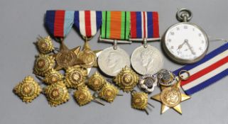 A group of five WW2 medals, together with a selection of cap badges and a GS Mk.II pocket watch
