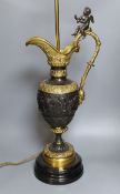 A large decorative bronze and ormolu 'ewer' lamp with seated cherub - 75.5cm tall
