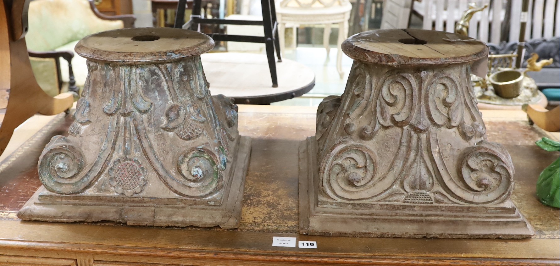 A near pair of carved and painted wood Corinthian column capitals, width 41cm, depth 41cm, height