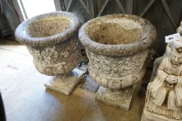 A pair of reconstituted stone campana garden urns, diameter 46cm height 60cm