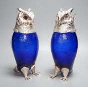 A pair of modern silver plated and blue glass novelty owl flasks,28.5 cms high.