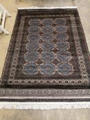 A Karachi blue-brown rug, 180 x 125cm