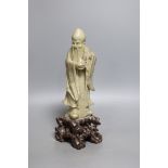 An early 20th century Chinese carved soapstone model of a sage - 23.5cm tall