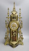 An ornamental gilt brass clock with French bell striking movement - 59cm tall